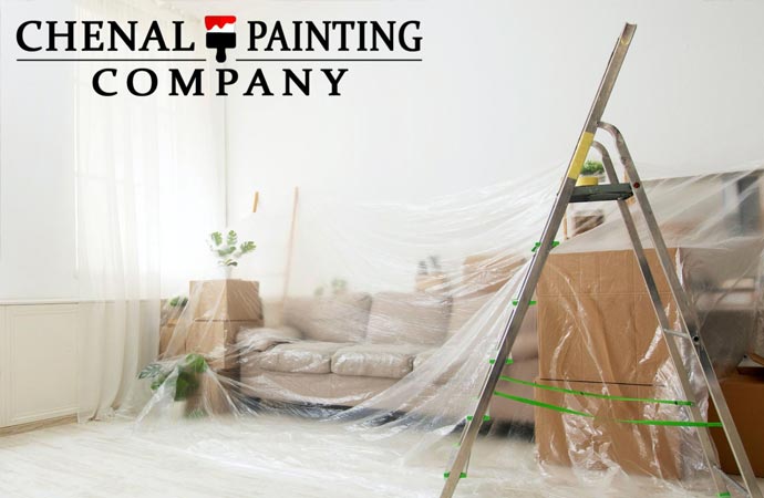 Interior painting project with drop cloth covered by upholstery.