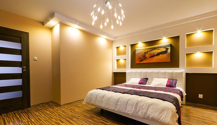 A modern bedroom with warm beige and brown painted walls