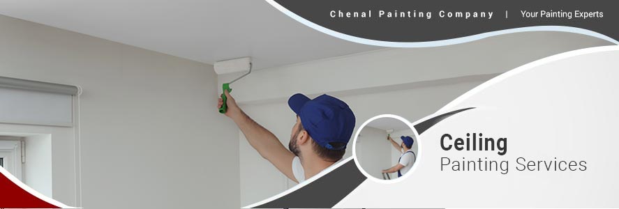handyman painting ceiling with white dye indoors