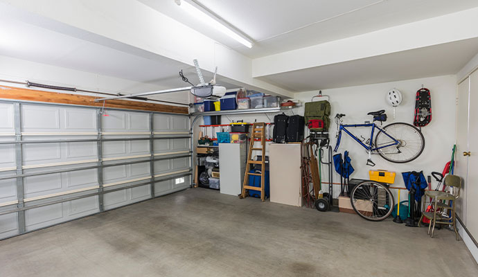 A cluttered residential garage in need of organization.