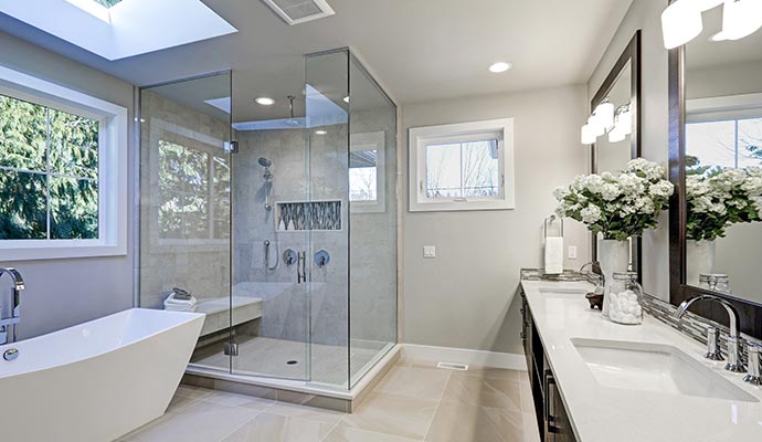 Master bathroom cabinets with Carrara marble tile surround