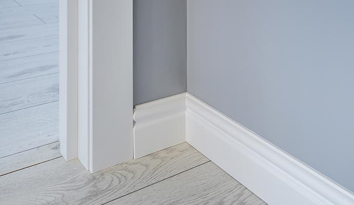 Baseboards and architrave around a doorway
