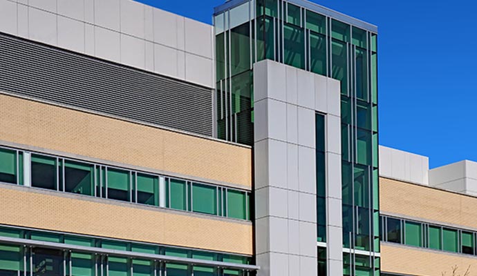 Newly painted hospital exterior with bright yellow walls