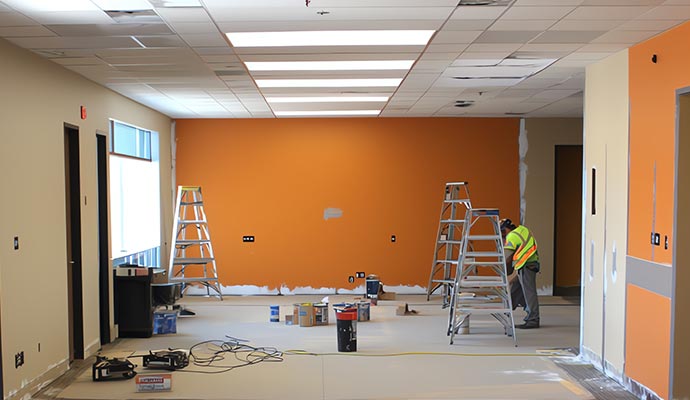 Professional painter an office space wall