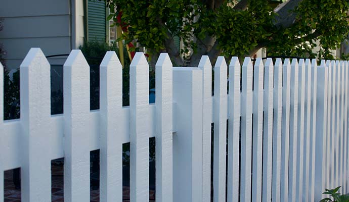 A cleanly painted white fence