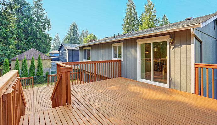 Spacious wooden deck A large, multi-level wooden deck on the back of a house.
