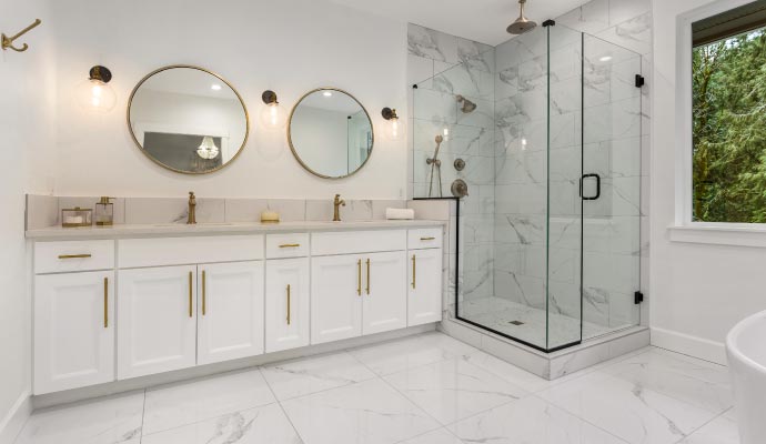 A modern bathroom with white refaced vanity cabinets A modern bathroom with white refaced vanity cabinets
